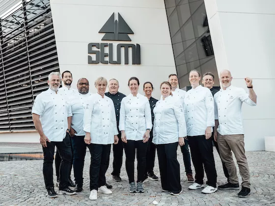 The chefs and ambassadors in front of the Selmi headquarters